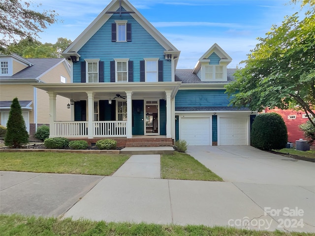 view of front of property with a garage and covered porch