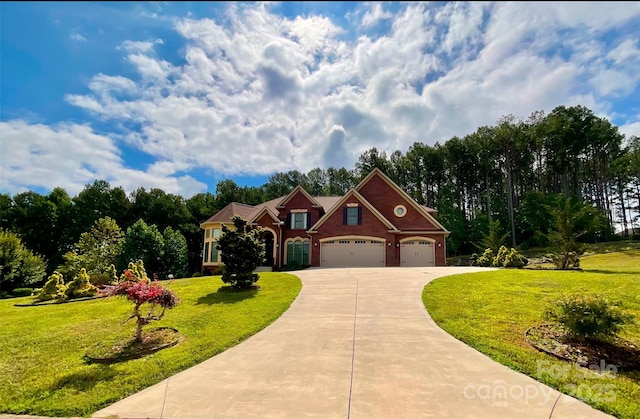 view of front of house with a front lawn and a garage