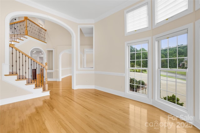 interior space with crown molding and hardwood / wood-style flooring