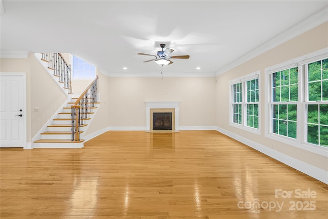 unfurnished living room with ceiling fan, light hardwood / wood-style flooring, and crown molding