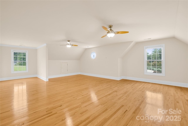 bonus room featuring ceiling fan, lofted ceiling, and light hardwood / wood-style flooring