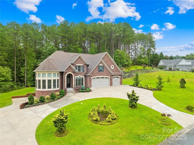 view of front of home featuring a garage and a front lawn