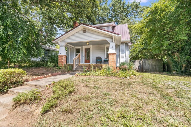 view of front facade with a porch and a front yard