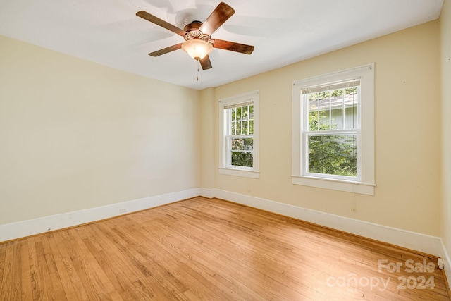 empty room with light hardwood / wood-style floors and ceiling fan