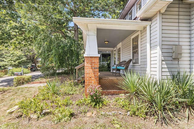 doorway to property with a porch