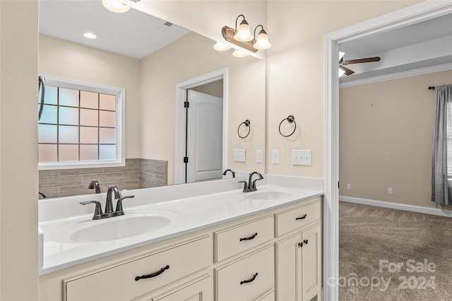 bathroom with ceiling fan, crown molding, and vanity