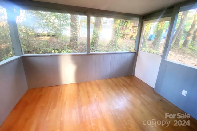 unfurnished sunroom featuring plenty of natural light