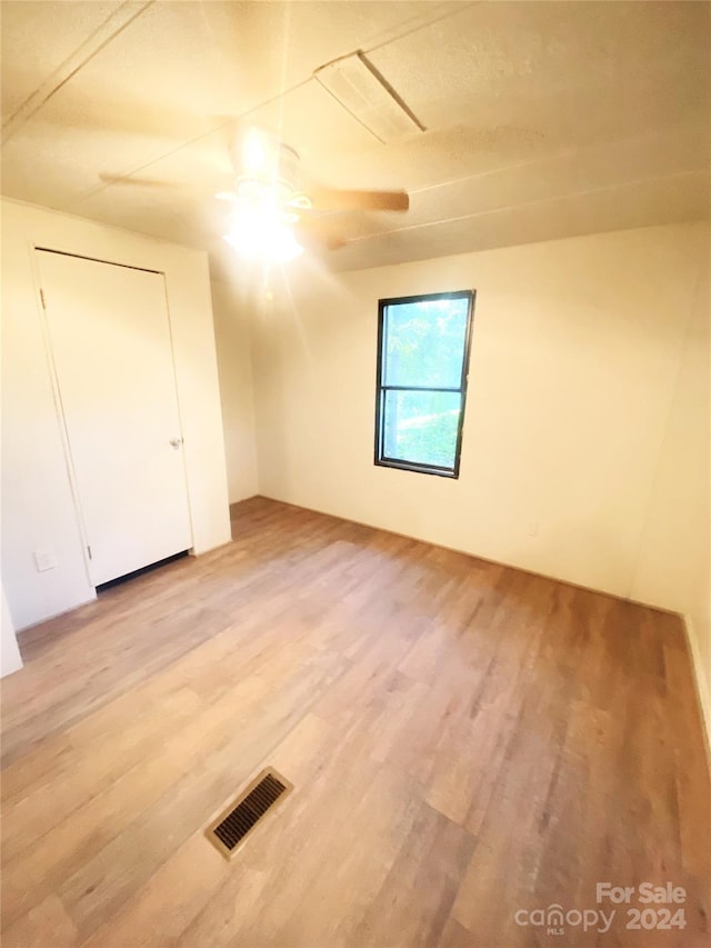 bonus room featuring ceiling fan and light wood-type flooring