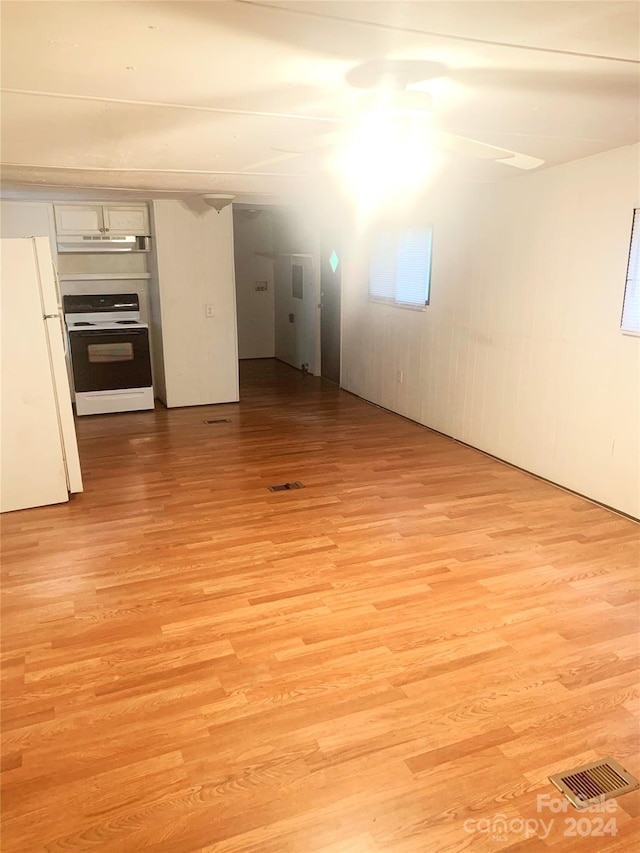 unfurnished living room featuring light wood-type flooring