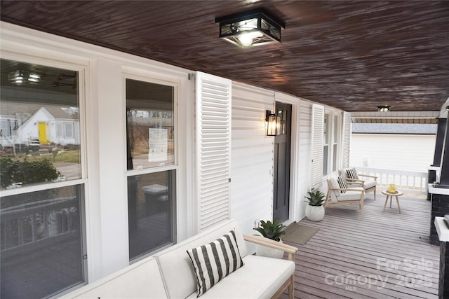 wooden terrace featuring covered porch