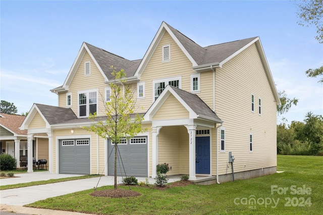 view of front facade featuring a garage and a front lawn