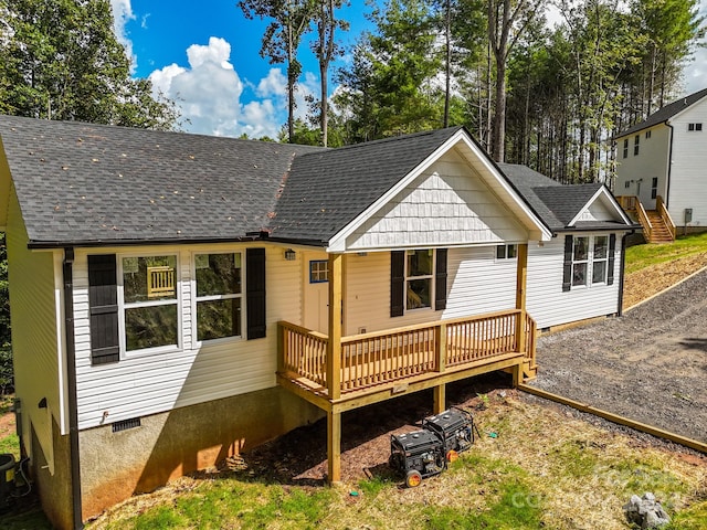 view of front of home featuring a wooden deck