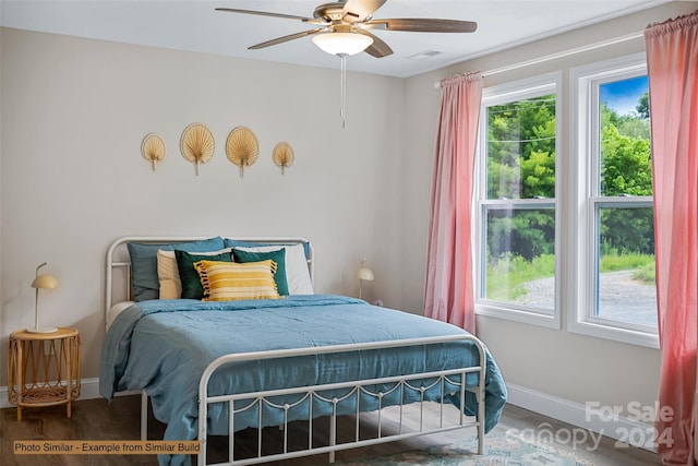 bedroom with dark wood-type flooring and ceiling fan