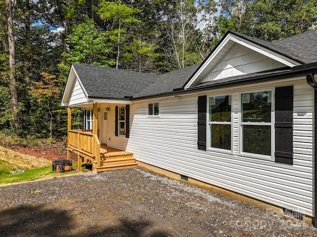 view of front of property with a wooden deck