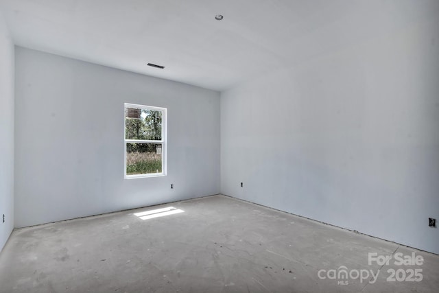 unfurnished room featuring visible vents and unfinished concrete flooring