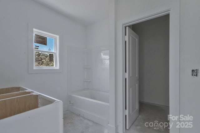bathroom featuring concrete flooring