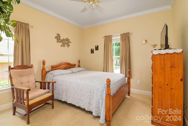 bedroom with ceiling fan, light colored carpet, and ornamental molding