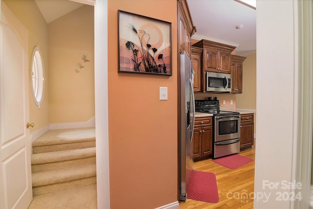 kitchen with light hardwood / wood-style flooring and stainless steel appliances