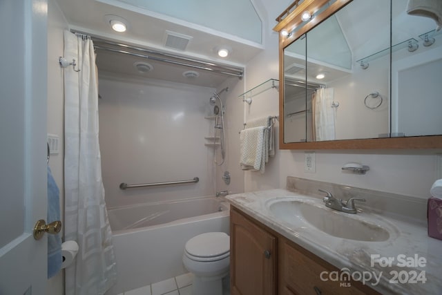 full bathroom featuring tile patterned floors, vanity, toilet, and shower / bath combo with shower curtain