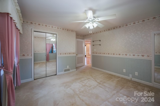 unfurnished bedroom featuring a closet and ceiling fan