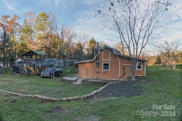 view of outbuilding with a lawn