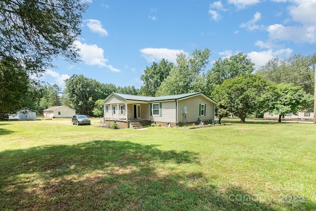 back of property featuring a lawn