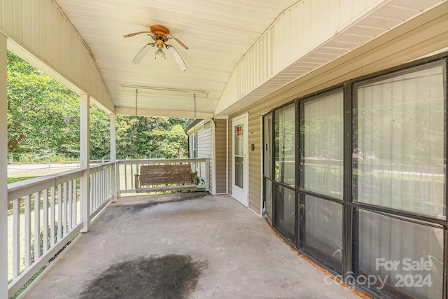 view of patio with ceiling fan and a porch