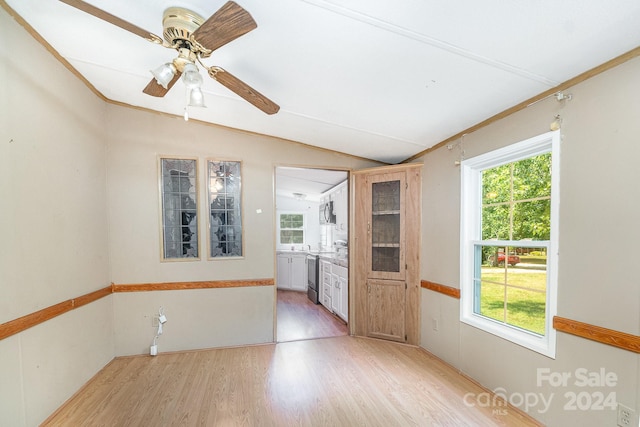 interior space featuring light hardwood / wood-style floors, lofted ceiling, and ceiling fan