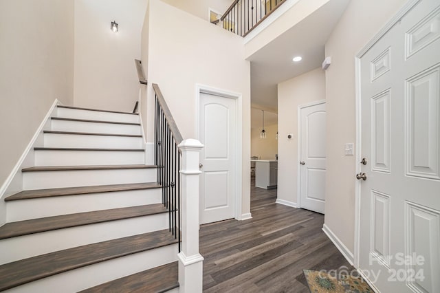 staircase featuring hardwood / wood-style floors