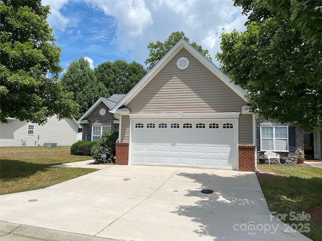 view of front of property featuring a garage and a front yard