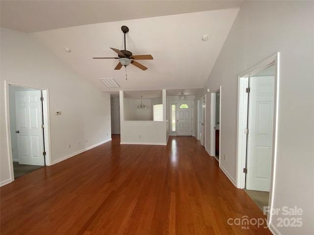 unfurnished living room featuring lofted ceiling, hardwood / wood-style floors, and ceiling fan