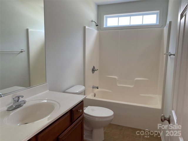 full bathroom featuring tile patterned flooring, vanity, bathtub / shower combination, and toilet