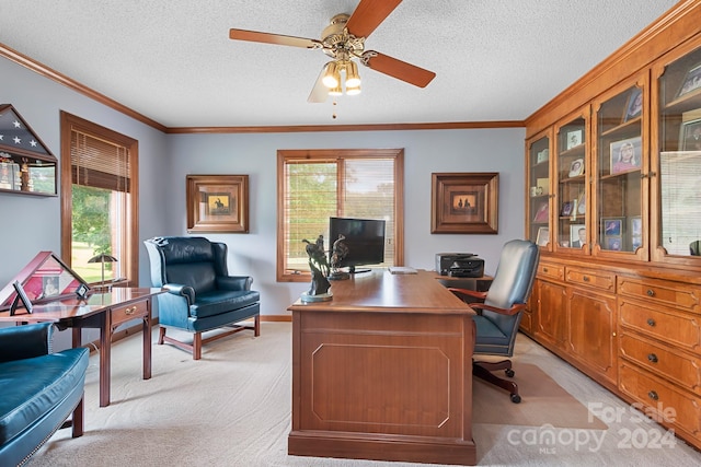 office with light carpet, a textured ceiling, crown molding, and ceiling fan