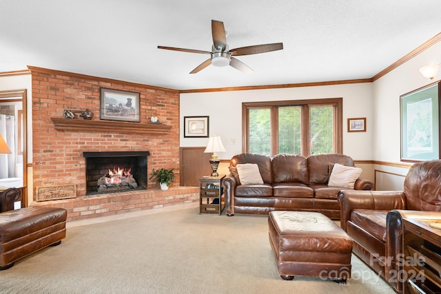 living room featuring ceiling fan, a brick fireplace, crown molding, and carpet flooring