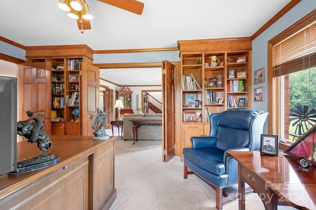 sitting room featuring ceiling fan, light colored carpet, and ornamental molding