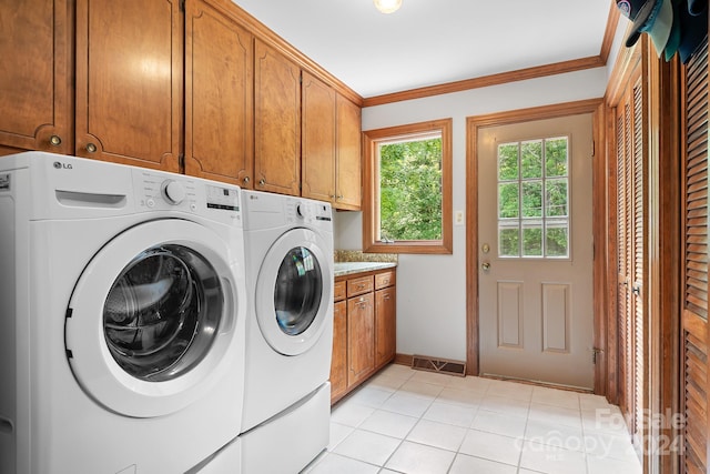 4299 Randleman Rd, Iron Station, NC 28080 - washroom featuring cabinet space, ornamental molding, visible vents, light tile patterned flooring, and washing machine and dryer