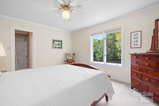 bedroom with ceiling fan, light colored carpet, and crown molding