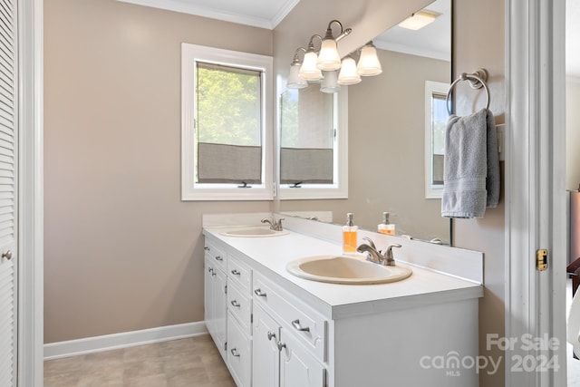 bathroom featuring vanity, crown molding, and an inviting chandelier