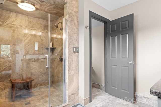 bathroom with a shower with shower door