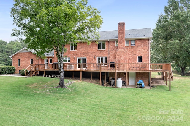 4299 Randleman Rd, Iron Station, NC 28080 - rear view of house featuring a chimney, a yard, a deck, and brick siding