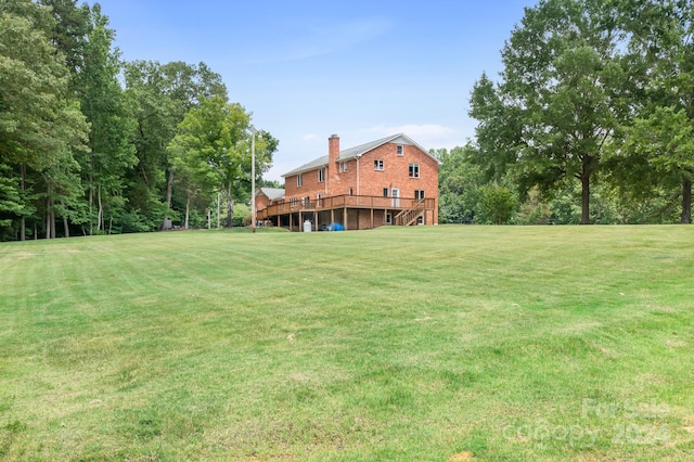 view of yard featuring a wooden deck