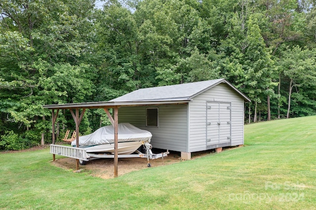 view of outbuilding with a lawn