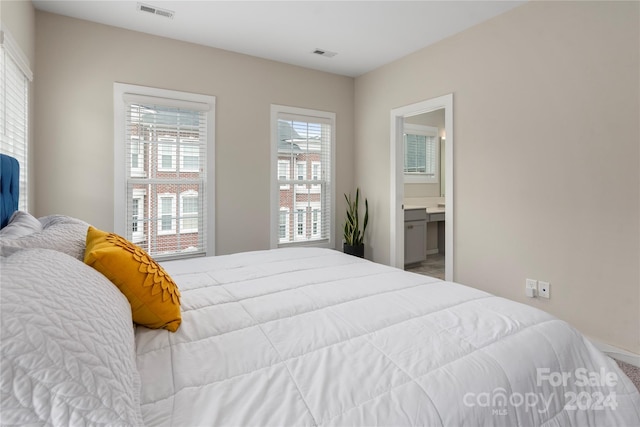 bedroom featuring ensuite bathroom