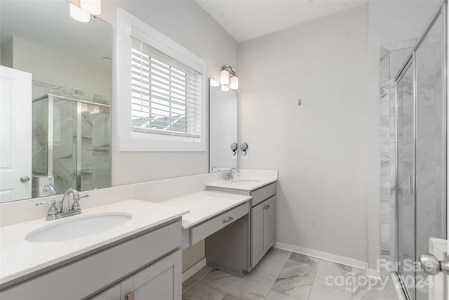 bathroom featuring vanity and a shower with shower door