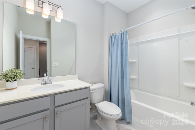 full bathroom with shower / tub combo, vanity, and toilet