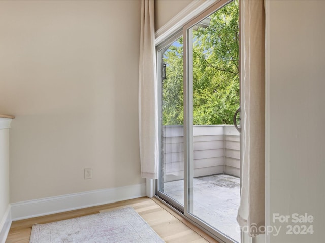 doorway with light hardwood / wood-style floors