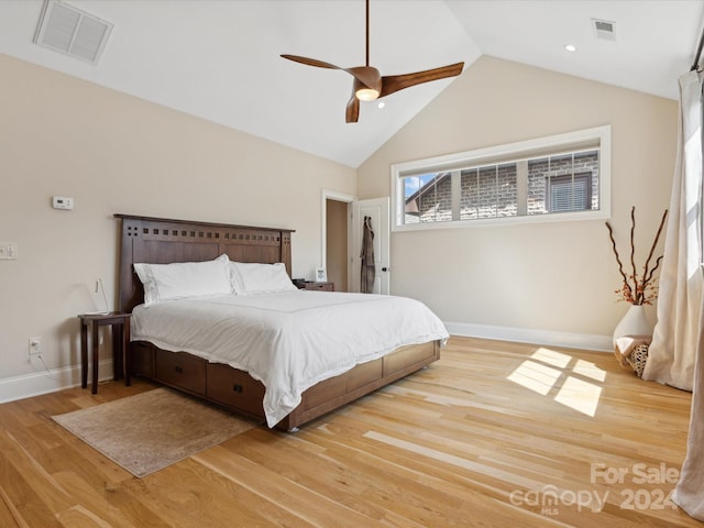 bedroom featuring vaulted ceiling, light hardwood / wood-style flooring, and ceiling fan