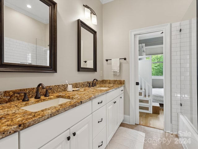 bathroom featuring tile patterned flooring and vanity