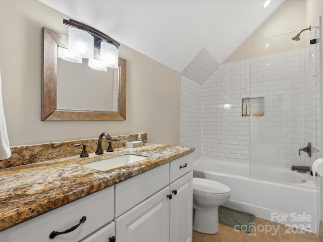 full bathroom featuring tiled shower / bath combo, tile patterned floors, vaulted ceiling, toilet, and vanity