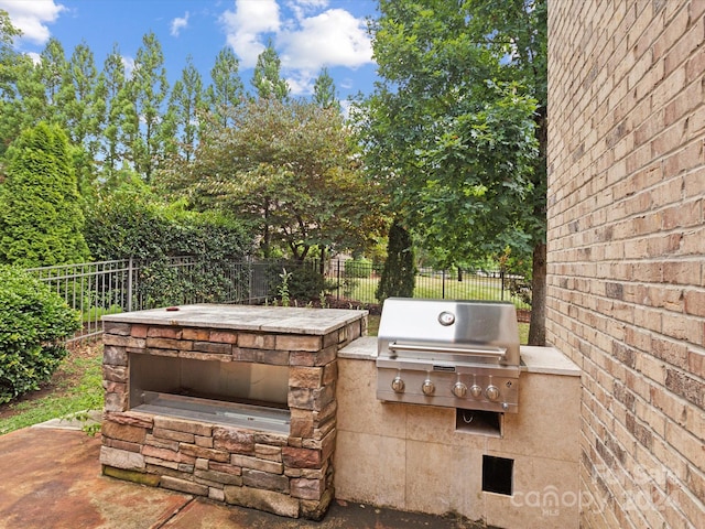 view of patio / terrace with exterior kitchen and grilling area